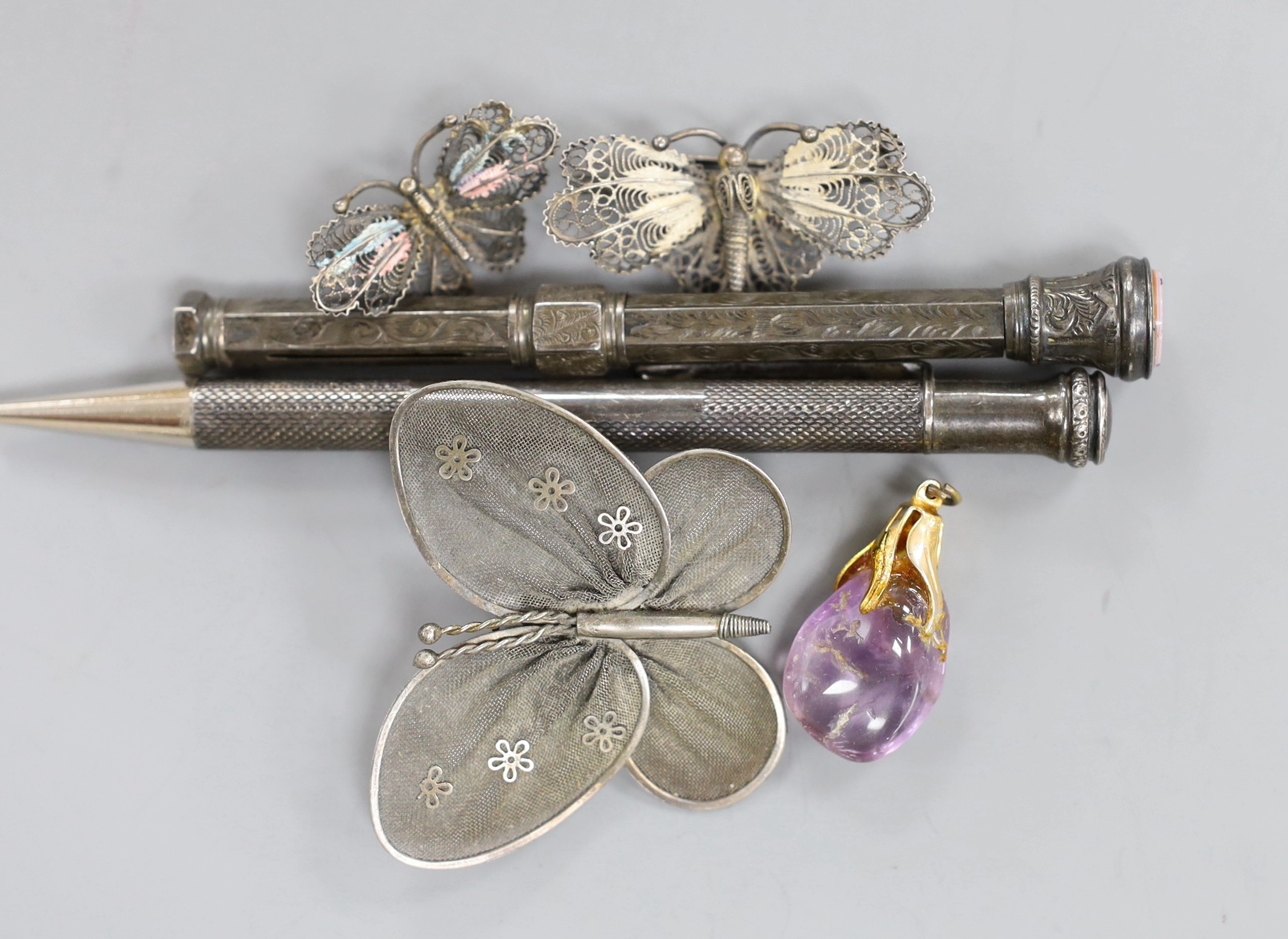 A modern novelty silver owl book mark, by Dix Jewellery Ltd, two Sterling propelling pencils filigree work brooches, various rings and a mounted amethyst pendant.